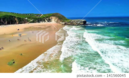 Aerial Drone View of a Gorgeous, Serene Beach Showcasing Clear Blue Waters and Sandy Shoreline Aerial Drone View of a Gorgeous, Serene Beach Showcasing Clear Blue Waters and Sandy Shoreline 141560045