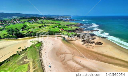 Breathtaking Coastal Views of a Peaceful Beach Surrounded by Lush Greenery and Scenic Hills Breathtaking Coastal Views of a Peaceful Beach Surrounded by Lush Greenery and Scenic Hills 141560054