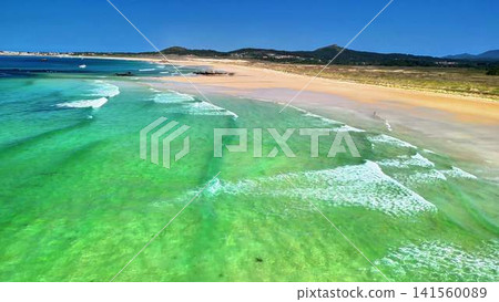A Breathtaking Aerial View Showcasing a Beautiful Tropical Beach and Its Crystal Clear Waters A Breathtaking Aerial View Showcasing a Beautiful Tropical Beach and Its Crystal Clear Waters 141560089