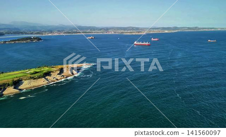 A Stunning Aerial View of a Serene Coastal Landscape Featuring Ships and Beautiful Green Shores A Stunning Aerial View of a Serene Coastal Landscape Featuring Ships and Beautiful Green Shores 141560097