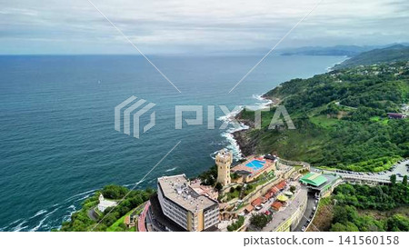 Overview of a Scenic Coastal Resort Featuring Stunning Ocean and Majestic Mountain View 141560158