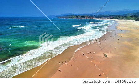 Aerial View of a Beautiful and Vibrant Beach with Surfers and Sunbathers Enjoying Together Aerial View of a Beautiful and Vibrant Beach with Surfers and Sunbathers Enjoying Together 141560159
