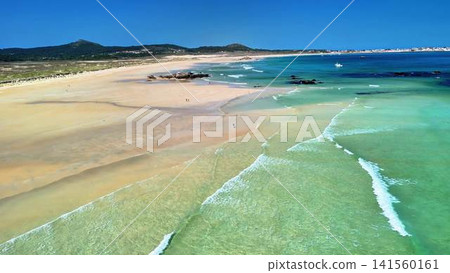Experience the breathtaking and serene beach view with its clear waters and golden sandy shores Experience the breathtaking and serene beach view with its clear waters and golden sandy shores 141560161