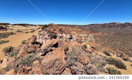 The breathtaking and stunning Rocky Desert Landscape showcases an expansive clear blue sky 141560190