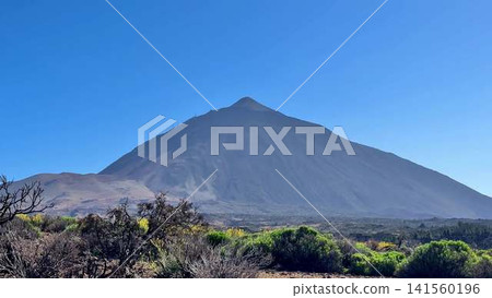 Majestic and breathtaking View of a Volcanic Landscape beneath Clear and Bright Blue Skies Majestic and breathtaking View of a Volcanic Landscape beneath Clear and Bright Blue Skies 141560196