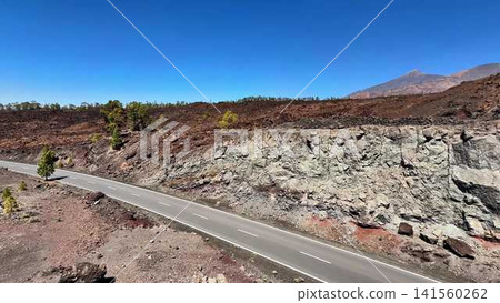 A Scenic Road Through a Beautiful Volcanic Landscape of Majestic Mountains and Calm Nature A Scenic Road Through a Beautiful Volcanic Landscape of Majestic Mountains and Calm Nature 141560262