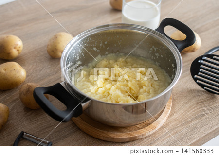 Preparing homemade mashed potatoes Preparing homemade mashed potatoes 141560333