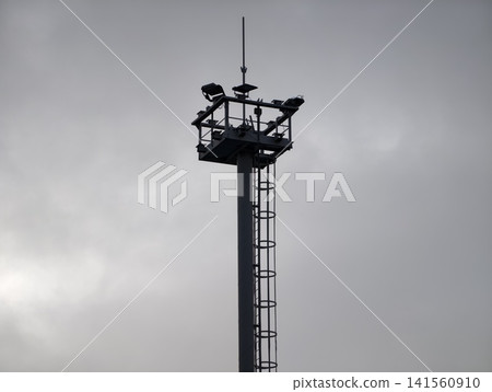 Facility inspection under cloudy sky. Maintenance structure equipped for safety and repair tasks Facility inspection under cloudy sky. Maintenance structure equipped for safety and repair tasks 141560910