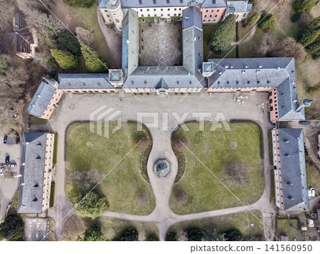 Serene courtyard with water feature. Peaceful garden landscape showing pathways and decorative fountain Serene courtyard with water feature. Peaceful garden landscape showing pathways and decorative fountain 141560950