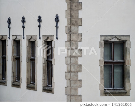 Intricate stone window designs and craftsmanship evoke timeless architectural heritage and preservation Intricate stone window designs and craftsmanship evoke timeless architectural heritage and preservation 141561005