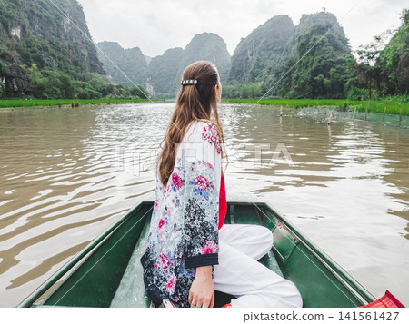 Cute woman and stunning river views in Ninh Binh Cute woman and stunning river views in Ninh Binh 141561427