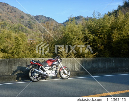 A leisurely ride on my motorcycle early in the morning 141563453