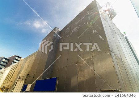 Construction site of a new apartment building in the densely populated urban area of Tokyo. Construction site of a new apartment building in the densely populated urban area of Tokyo. 141564346