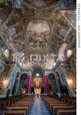 Pietra ligure, liguria, italy. June 24, 2025. Basilica of san nicolo in pietra ligure, italy, featuring a ornate baroque interior with rich frescoes and gold decorations Pietra ligure, liguria, italy. June 24, 2025. Basilica of san nicolo in pietra ligure, italy, featuring a ornate baroque interior with rich frescoes and gold decorations 141564419