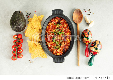 Mexican Chili Con Carne with Avocado, Peppers, and Maracas Mexican Chili Con Carne with Avocado, Peppers, and Maracas 141564618