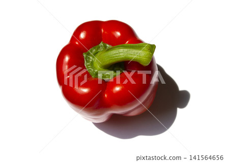 It is a bell pepper placed on a white background. It is a bell pepper placed on a white background. 141564656