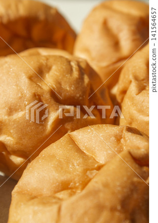 It is a well-baked morning roll. It is a well-baked morning roll. 141564657
