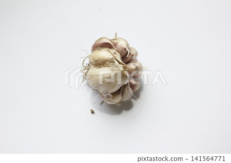 Garlic on a white background. 141564771