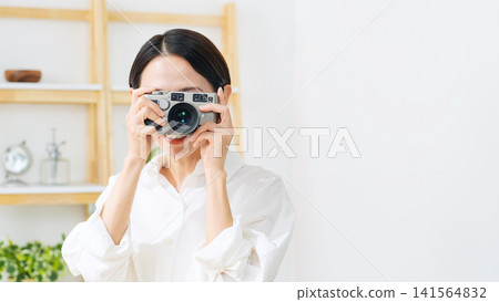A woman with a camera. Photography, shooting, smile, female photographer, hobby, digital camera, side job, skills, video, studio. A woman with a camera. Photography, shooting, smile, female photographer, hobby, digital camera, side job, skills, video, studio. 141564832