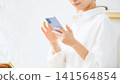 Middle-aged women using smartphones. Apps, social media, videos, smartphones, mobile, email, casual, cell phone. 141564854