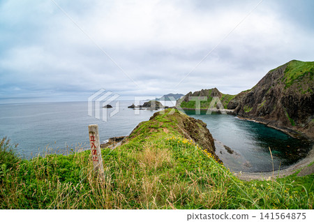 The crystal-clear sea and cliff scenery of Sukai Cape on Rebun Island. The crystal-clear sea and cliff scenery of Sukai Cape on Rebun Island. 141564875
