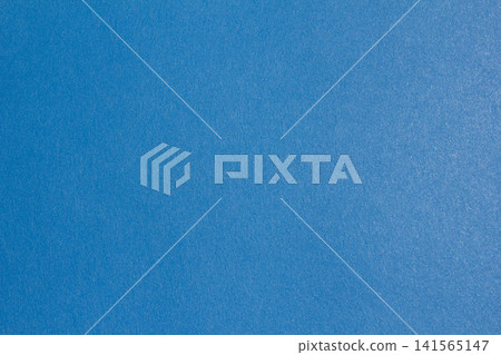 It is a blue colored paper background. 141565147