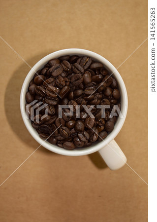 It is a mug and coffee beans. It is a mug and coffee beans. 141565263