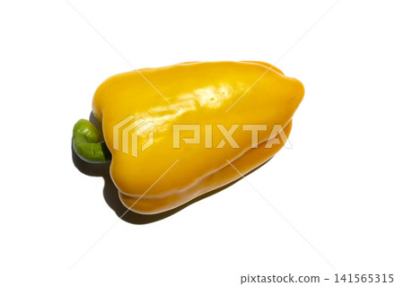 It is a bell pepper placed on a white background. It is a bell pepper placed on a white background. 141565315