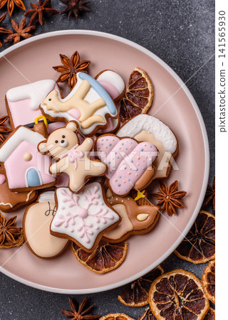 Gingerbread as a Christmas staple, sweet biscuits for the holiday. Gingerbread as a background Gingerbread as a Christmas staple, sweet biscuits for the holiday. Gingerbread as a background 141565930
