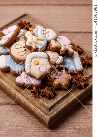Gingerbread as a Christmas staple, sweet biscuits for the holiday. Gingerbread as a background Gingerbread as a Christmas staple, sweet biscuits for the holiday. Gingerbread as a background 141565961