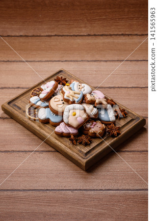 Gingerbread as a Christmas staple, sweet biscuits for the holiday. Gingerbread as a background Gingerbread as a Christmas staple, sweet biscuits for the holiday. Gingerbread as a background 141565963