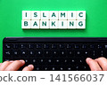 Islamic banking inscription above person typing on keyboard 141566037