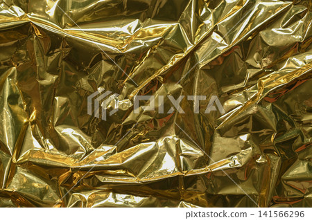 foil background with wrinkled golden material and glossy texture, 141566296