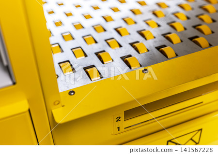Industrial conveyor roller bed system in a self service postal kiosk, illustrating efficient public service automation. Industrial conveyor roller bed system in a self service postal kiosk, illustrating efficient public service automation. 141567228