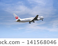 A Japan Airlines (JAL) Boeing 767 passenger plane taking off from Izumo Enmusubi Airport (with a blue sky background): Izumo City, Shimane Prefecture 141568046