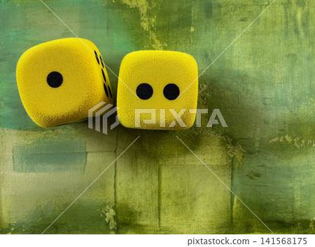 Luck and Chance Concept with Yellow Dice on Green Abstract Background - symbolizing luck, chance, probability, random choice, risk, decision making, games, strategy, and playful uncertainty. Luck and Chance Concept with Yellow Dice on Green Abstract Background - symbolizing luck, chance, probability, random choice, risk, decision making, games, strategy, and playful uncertainty. 141568175