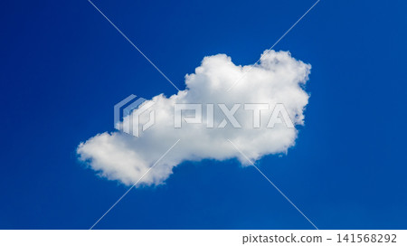 isolated white cloud in the middle of deep blue sky isolated white cloud in the middle of deep blue sky 141568292