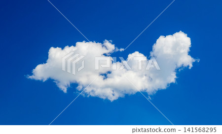 elongated white cumulus cloud in the center of blue sky elongated white cumulus cloud in the center of blue sky 141568295