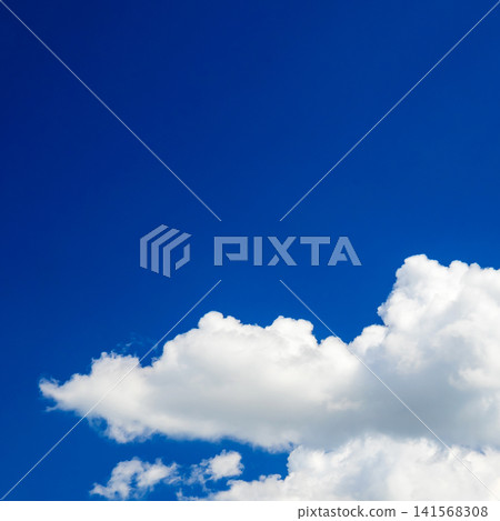 white cumulus cloud in the bottom part of the frame against an endless blue sky white cumulus cloud in the bottom part of the frame against an endless blue sky 141568308