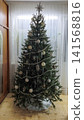 beautifully decorated Christmas tree with white ornaments, tinsel, 141568816