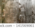Water droplets on window glass with condensation forming patterns, 141569061