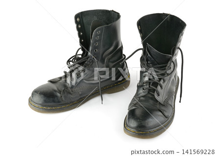 Pair of Worn Black Leather High Top Work Boots Isolated Against Pure White Background Pair of Worn Black Leather High Top Work Boots Isolated Against Pure White Background 141569228