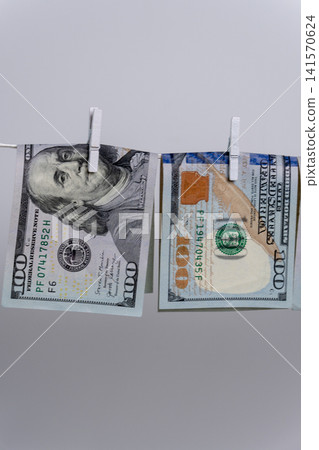 Two Dollar Bills Hanging Upside Down on Clothesline For Money Laundering Two Dollar Bills Hanging Upside Down on Clothesline For Money Laundering 141570624