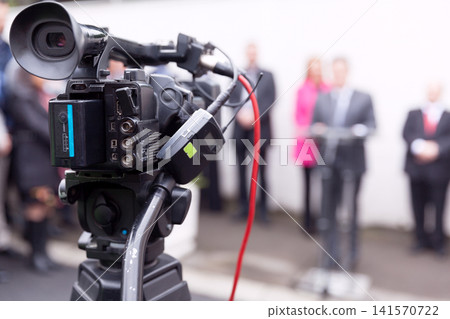 Filming news or press conference with a video camera 141570722