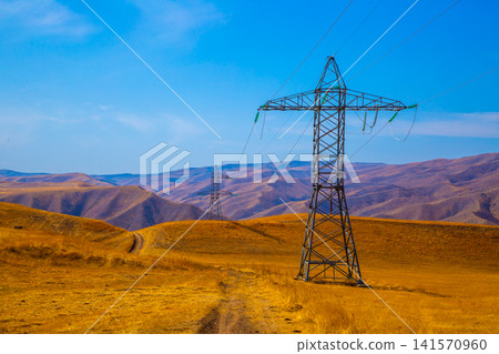 Electricity Pylons in Arid Landscape of Kyrgyzstan Electricity Pylons in Arid Landscape of Kyrgyzstan 141570960