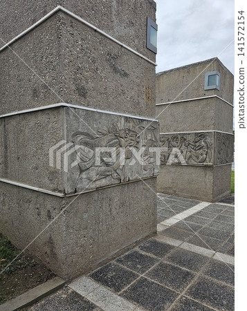 Cordoba, Argentina - April 11, 2026: Narrative Relief on Concrete Plaza Monument Cordoba, Argentina - April 11, 2026: Narrative Relief on Concrete Plaza Monument 141572154