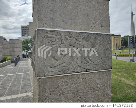 Cordoba, Argentina - April 11, 2026: Figurative Bas-Relief with Bicentennial Lighthouse Cordoba, Argentina - April 11, 2026: Figurative Bas-Relief with Bicentennial Lighthouse 141572158