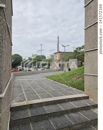 Cordoba, Argentina - April 11, 2026: Walkway Through Concrete Monuments at Plaza Espana Cordoba, Argentina - April 11, 2026: Walkway Through Concrete Monuments at Plaza Espana 141572169