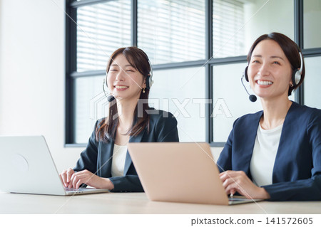 A woman working at a call center A woman working at a call center 141572605