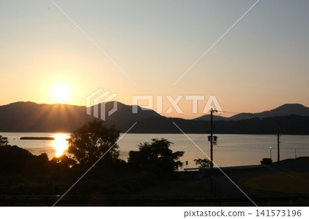 A breathtaking sunset over Lake Suigetsu, one of the Five Lakes of Mikata - a spectacular view for a Fukui sightseeing trip. A breathtaking sunset over Lake Suigetsu, one of the Five Lakes of Mikata - a spectacular view for a Fukui sightseeing trip. 141573196